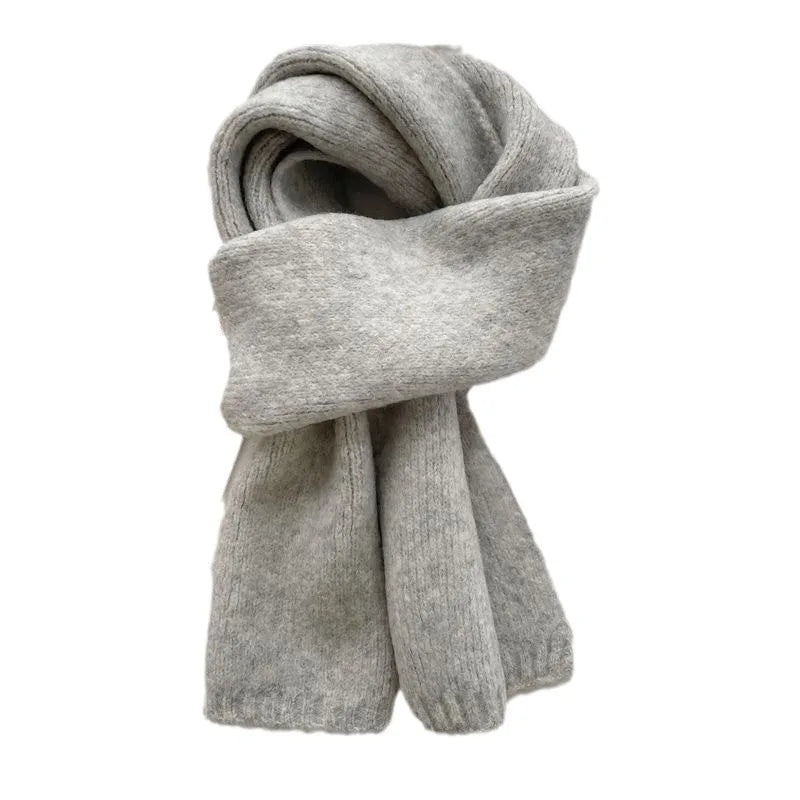 Solid color winter scarf styled with coat