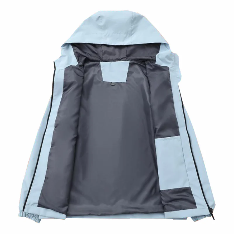 Person wearing windbreaker jacket while hiking outdoors
