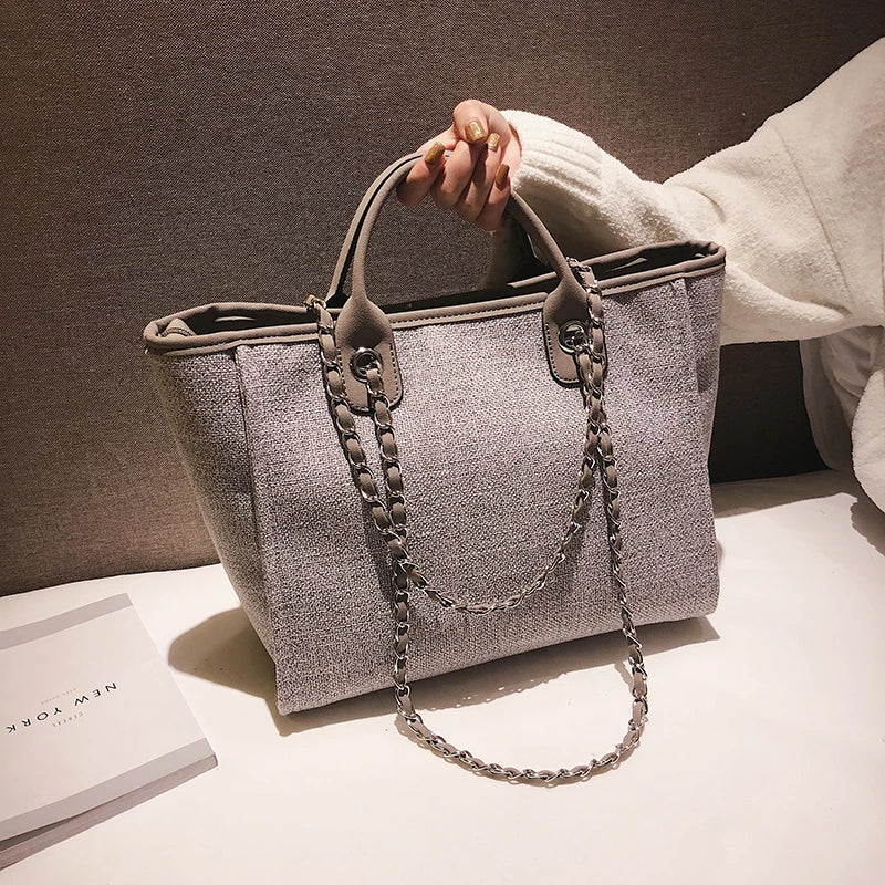 Large canvas tote bag carried on shoulder