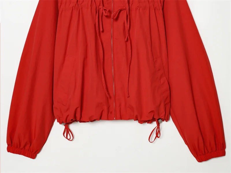 Woman wearing red zip-up hoodie cardigan outdoors