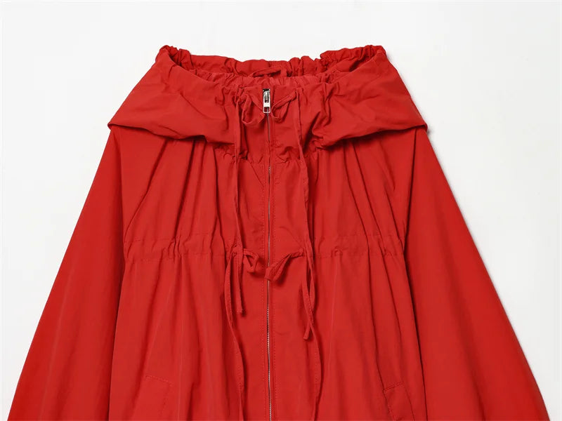 Close-up of red cardigan zipper and drawstring hood
