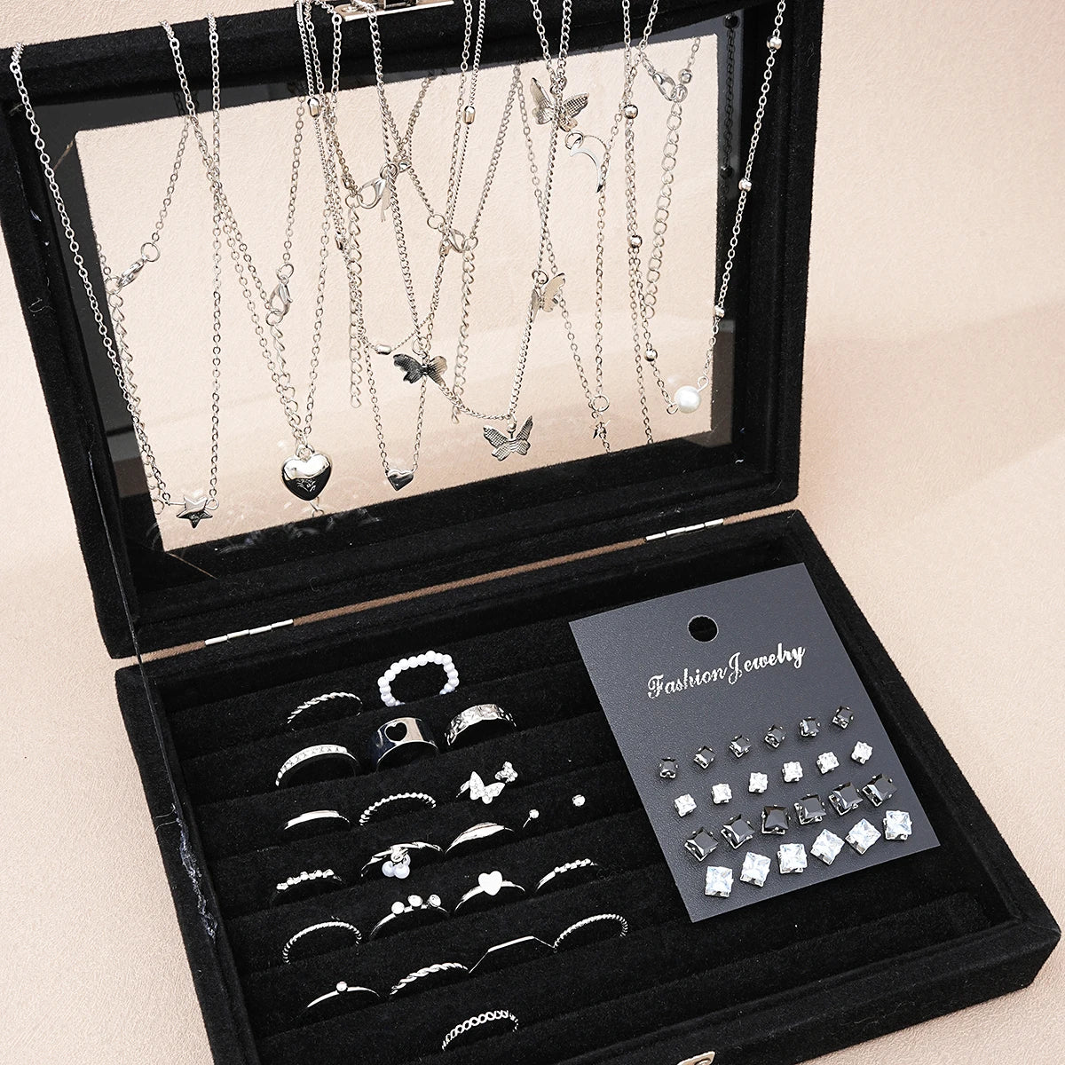 51-piece silver-tone jewelry set with necklaces, earrings, and rings