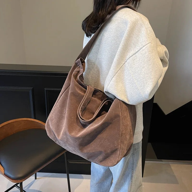 Suede crossbody tote bag interior pocket