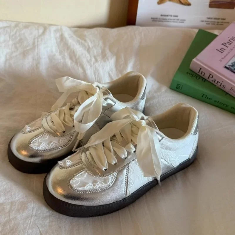 Lace-up sneakers top view showing breathable upper