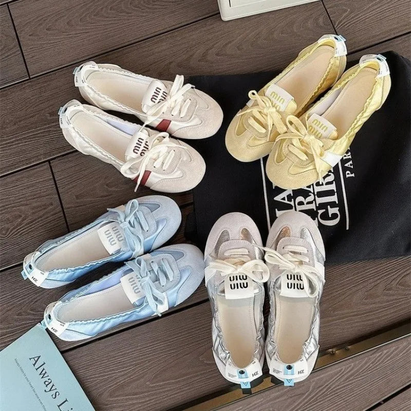 Woman wearing lace-up ballet flat sneakers